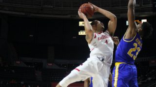 Cajuns Forward Kobe Julien goes for a contested shot in the lane on Saturday against McNeese State. Photo courtesy of Clint Domingue